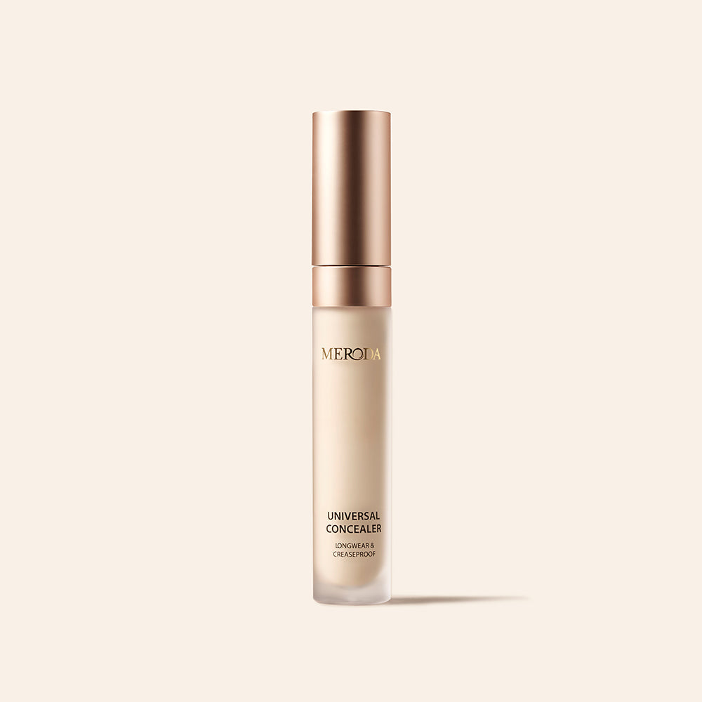 Universal Concealer tube with a rose gold cap and longwear, creaseproof benefits on a neutral background.