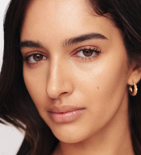 Gilded Lashes Mascara on model showing lengthened, volumised and defined lashes for a natural finish.
