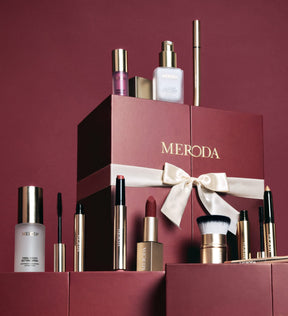 Advent Calendar - 12 Days of Effortless Beauty box surrounded by its collection of makeup and skincare products.