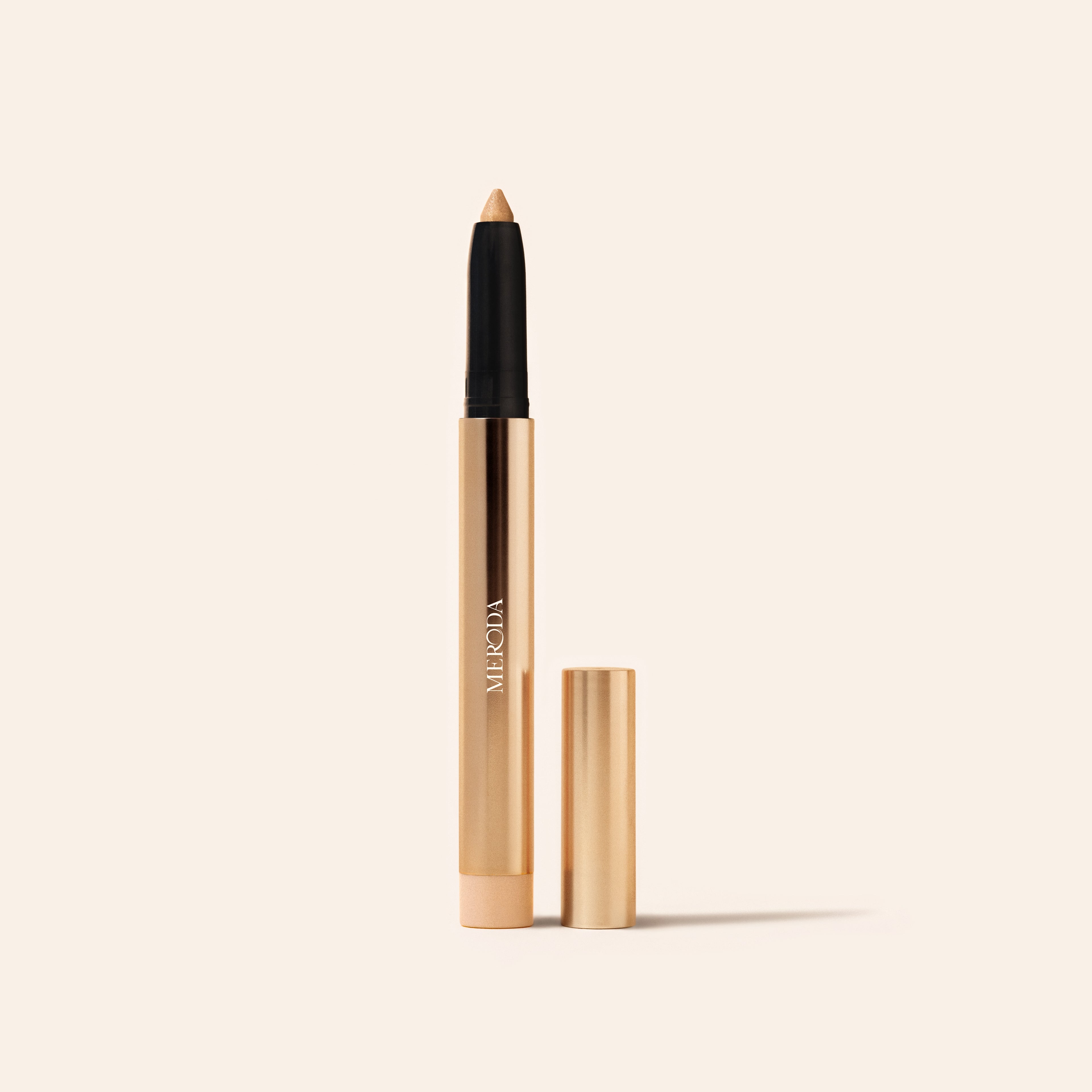 Eye Perfecting Shimmer Stick in Champagne featuring a luminous finish and a gold metallic casing.