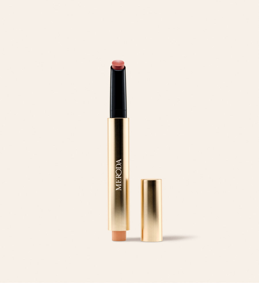 Hydrating Lip Tint in Honey Beige featuring a sleek gold pen with warm nude balm and detached cap on cream.