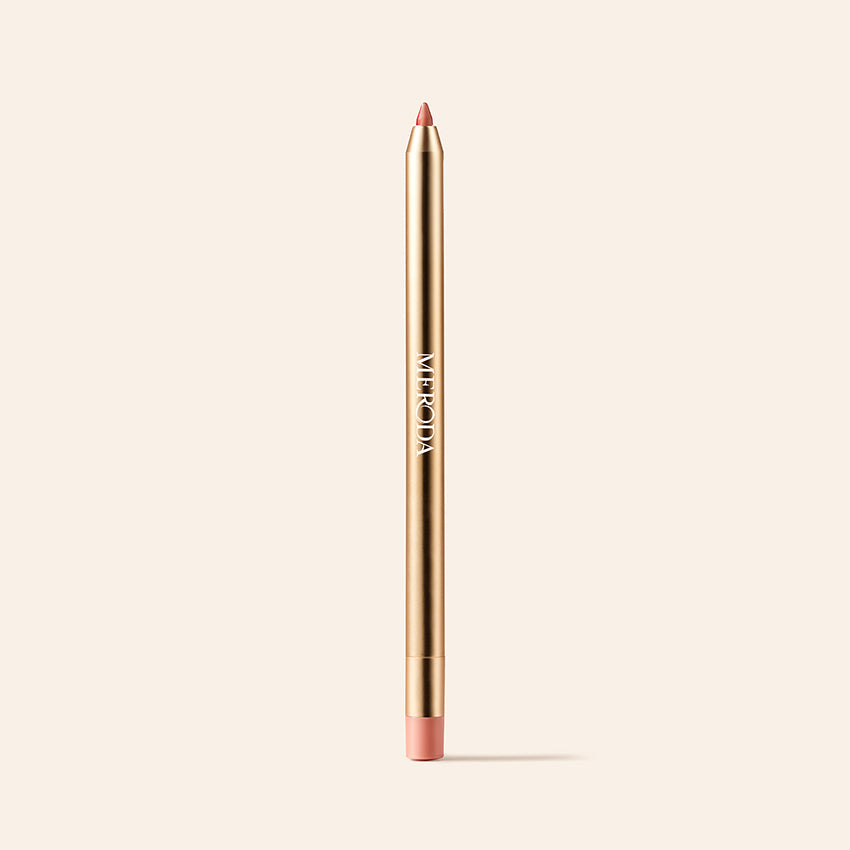 Signature Lip Pencil in Perfect Nude featuring a gold metallic body and pointed tip on a cream background.