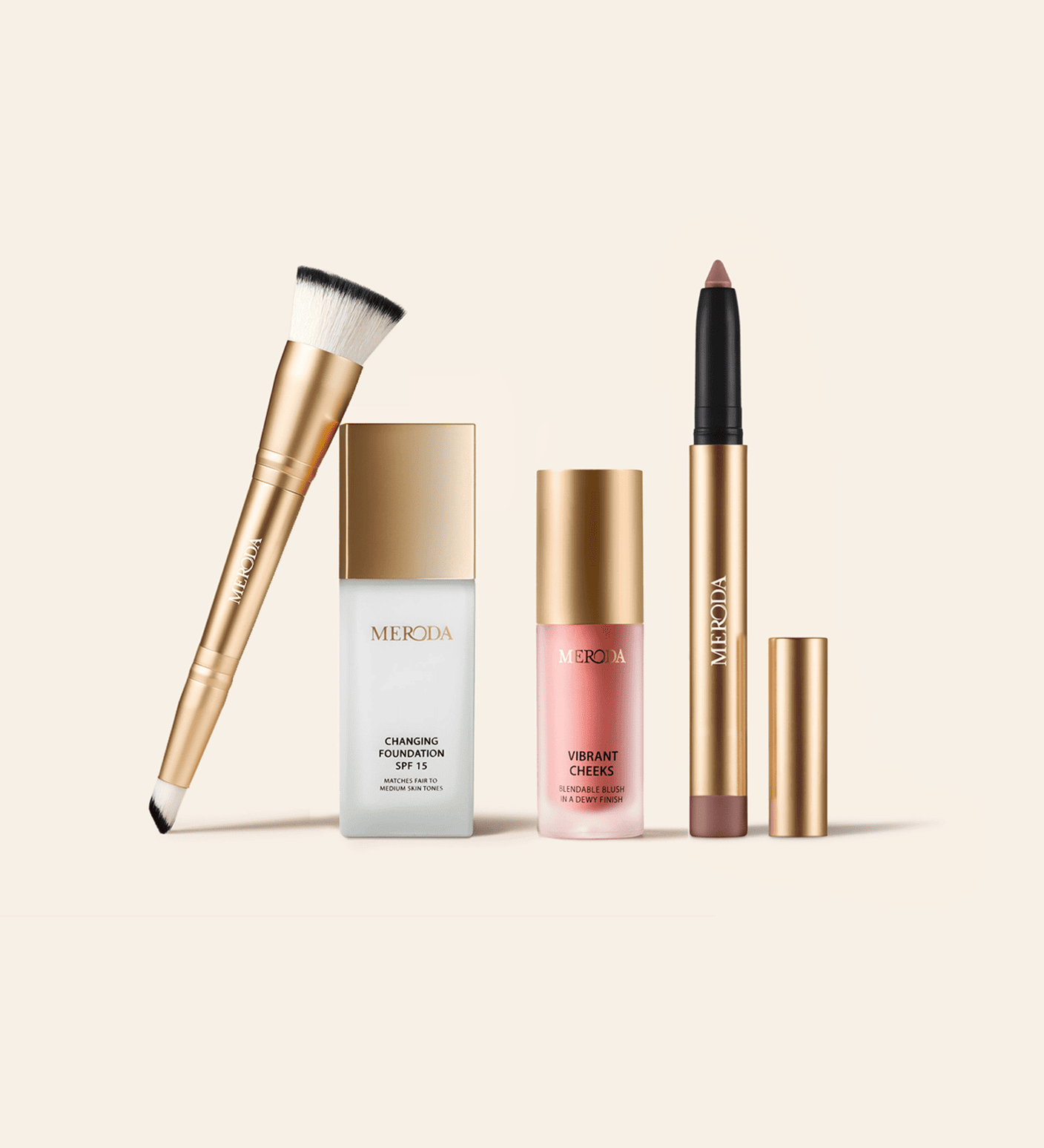The Daily Routine Set with Changing Foundation, Vibrant Cheeks liquid blush, shimmer stick and 2-in-1 brush in gold.