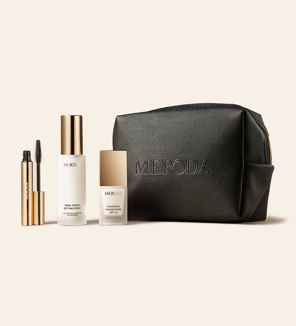 Travel Kit featuring mini Changing Foundation, Final Touch Setting Spray and Gilded Lashes Mascara with a black travel bag.