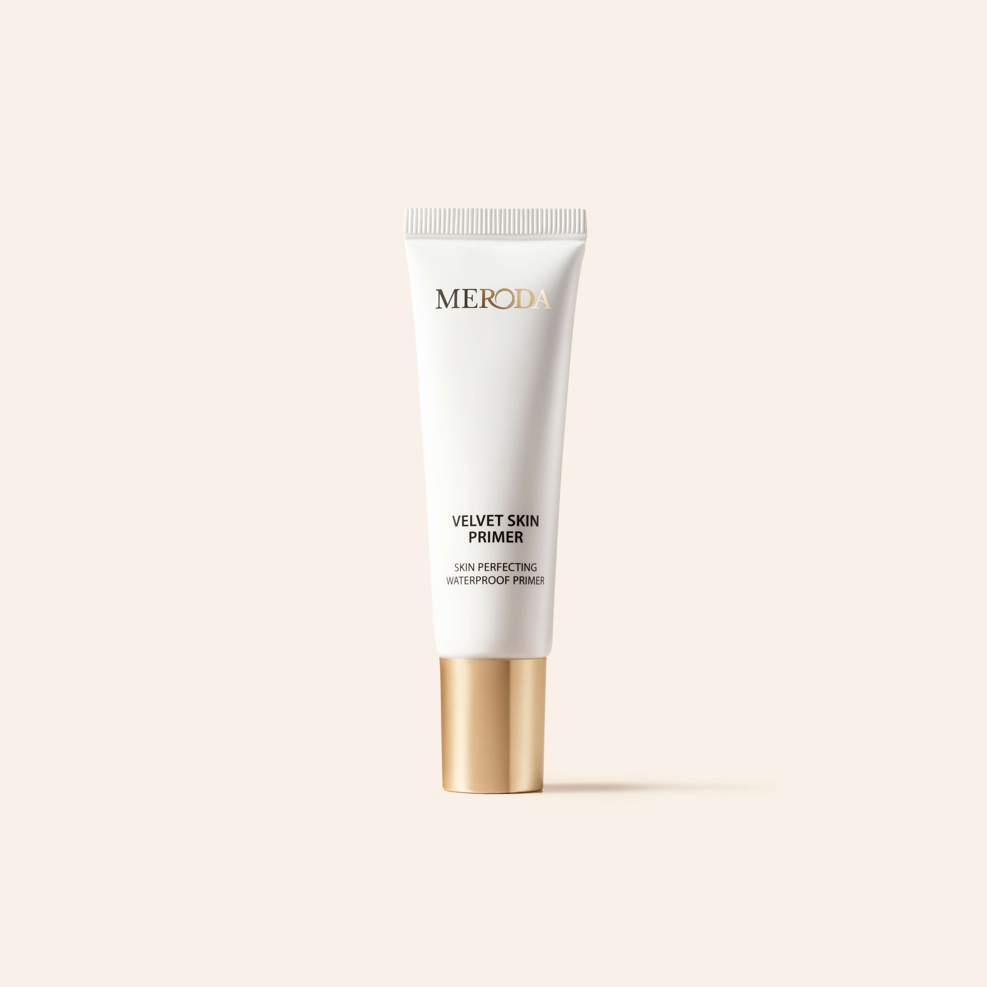 Mini Primer white tube with a gold cap, a travel-friendly smoothing base that blurs pores and fine lines.
