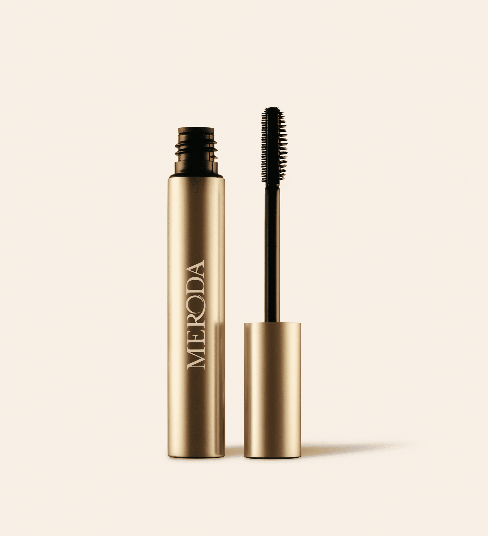 The Precision Brow Gel in an open gold tube featuring a silicone brush with dual-length bristles.