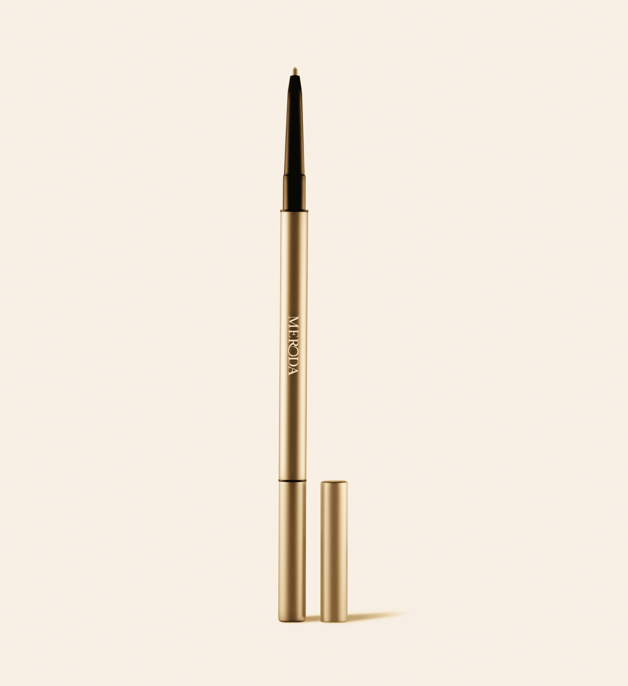 The Precision Brow Pencil in Blonde featuring a slim gold casing and an ultra-fine tip for hair-like precision.