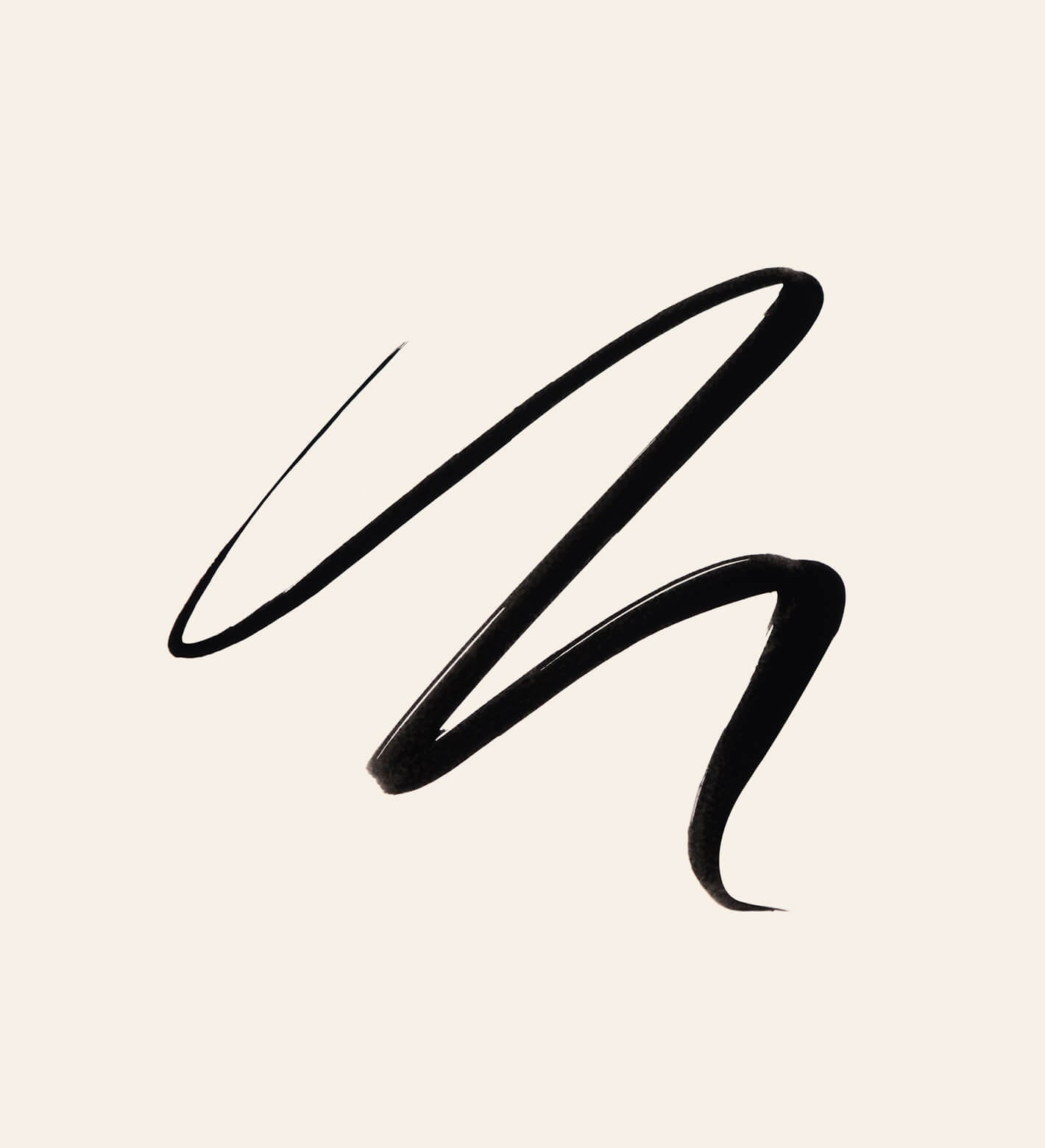 It's All About The Wing Liquid Waterproof Eyeliner intense black swatch showing a smooth, precise liquid stroke.