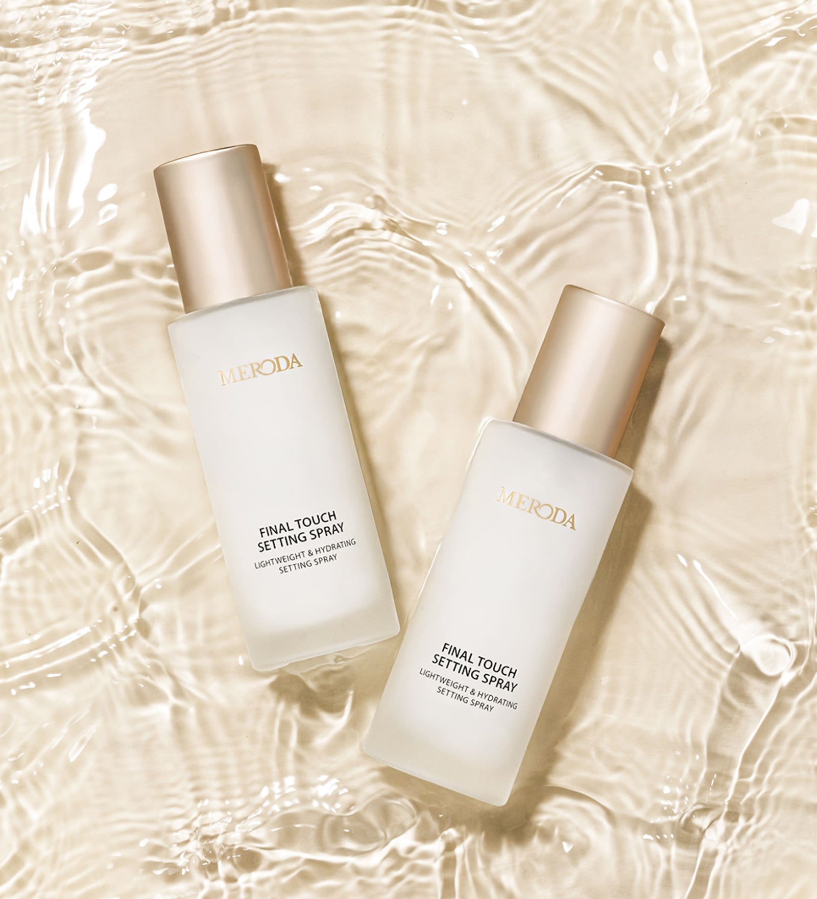 Final Touch Setting Spray bottles in clear rippling water, showcasing the hydrating and refreshing formula.